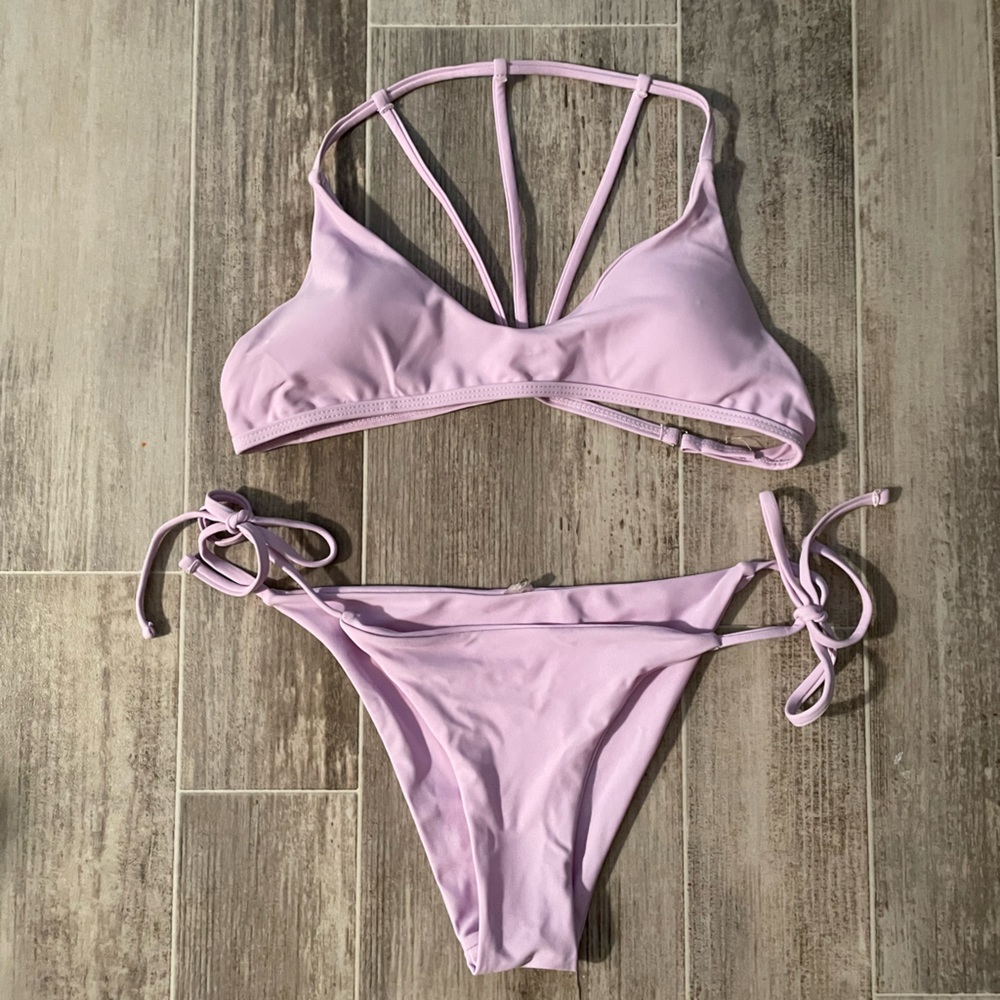 New purple swimsuit, very soft material. Never worn